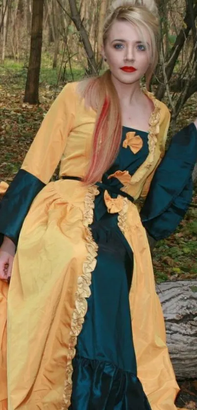 Woman in yellow gown sitting in forest