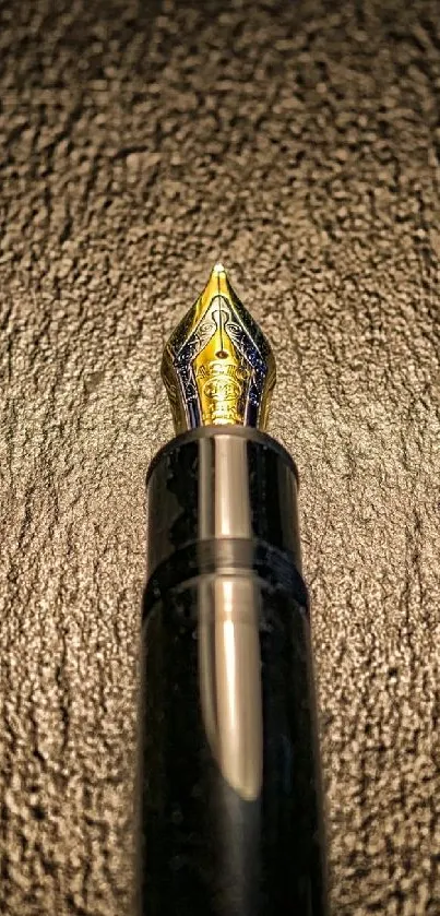 Elegant fountain pen on textured background wallpaper.