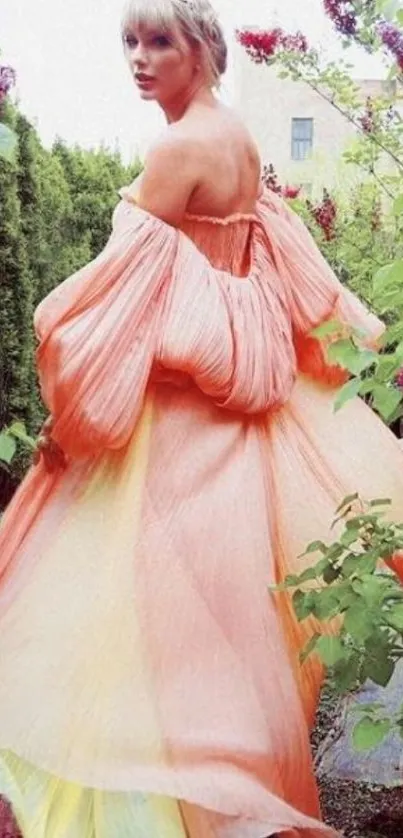 Elegant person in peach dress amidst vibrant garden.