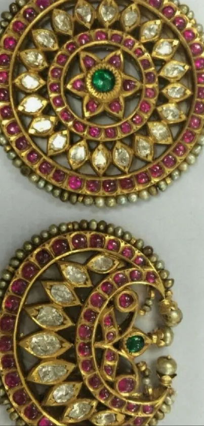 Intricately designed gold discs with vibrant gemstones.
