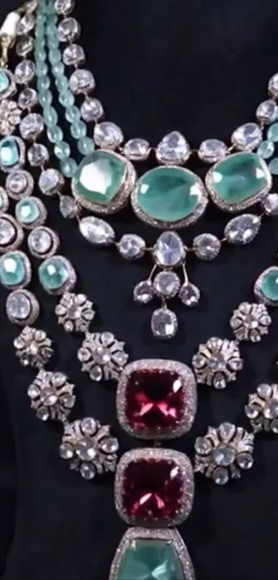 Luxurious gemstone necklace with emeralds and rubies on a black background.