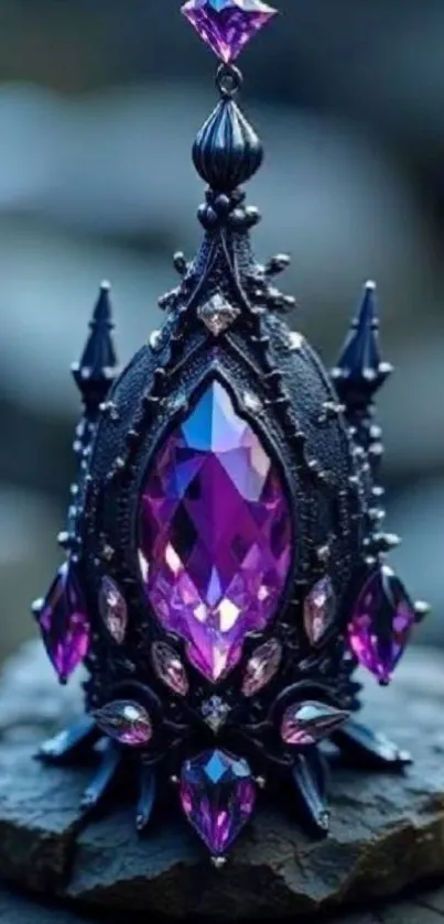 Ornate black and purple gemstone ornament on a wooden surface.