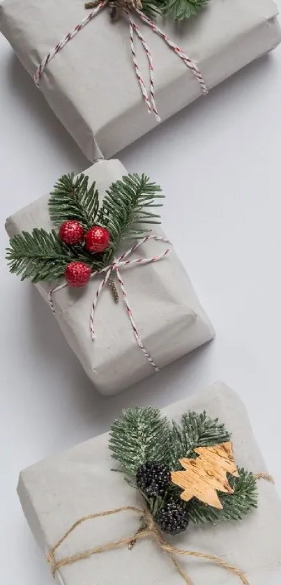 Three elegantly wrapped gift boxes with festive decorations.