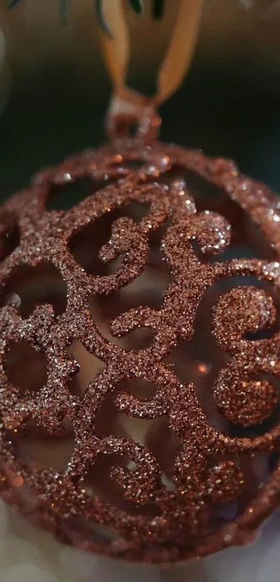 Intricate bronze glitter ornament wallpaper for festive décor.