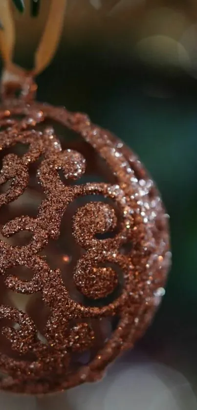 Close-up of a glittering bronze holiday ornament.