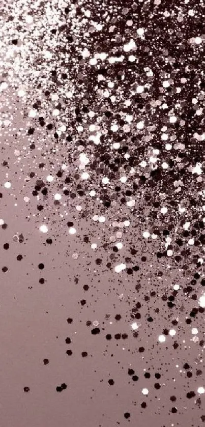 Dusty pink phone wallpaper with elegant glitter particles.