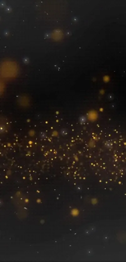 Dark wallpaper with golden glittering particles on a black background.