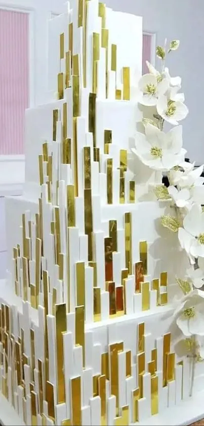 Tiered cake with gold accents and white flowers wallpaper.