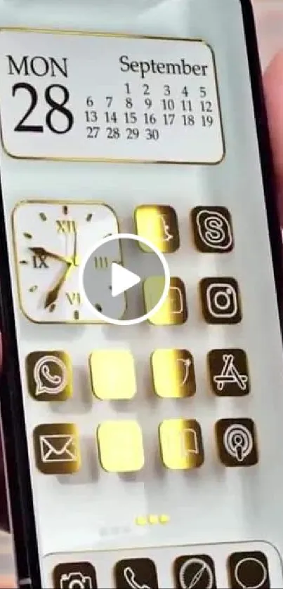 Luxury mobile wallpaper with elegant gold icons on a phone screen.