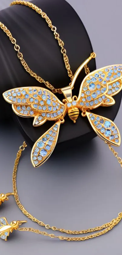 Elegant gold butterfly jewelry with blue gemstones.