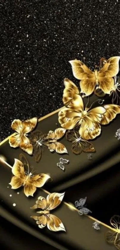 Gold butterflies on black glitter wallpaper.