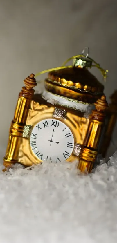 Golden clock ornament on white snow background.