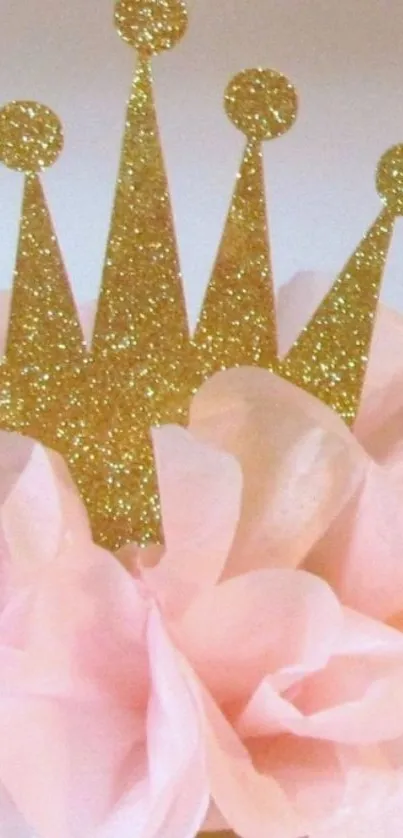 Gold glitter crown on pink background.