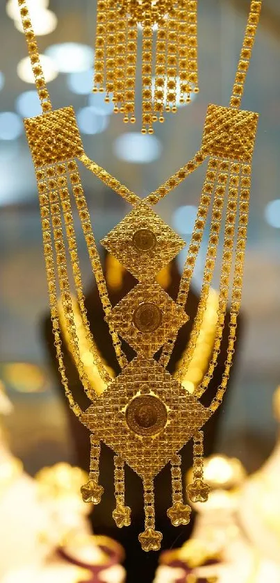 Close-up of intricate gold jewelry design on a blurred background.