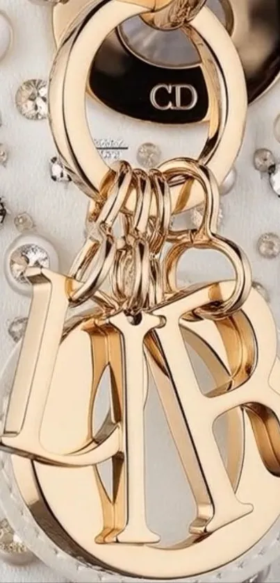 A luxurious gold keychain with crystal decorations.