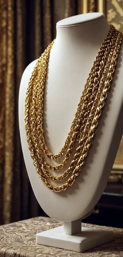 Elegant gold necklace on mannequin display.