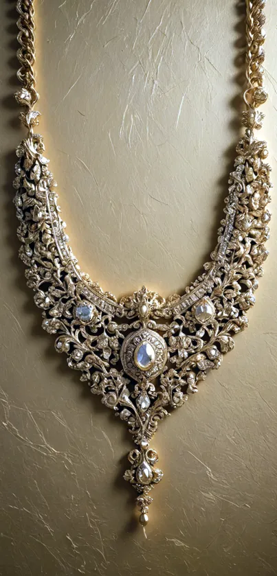 Elegant gold necklace with intricate design on a textured background.