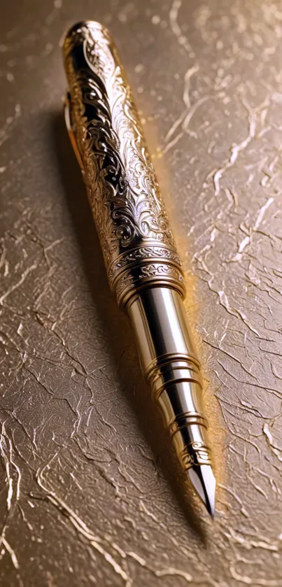 Elegant gold engraved pen on textured background.