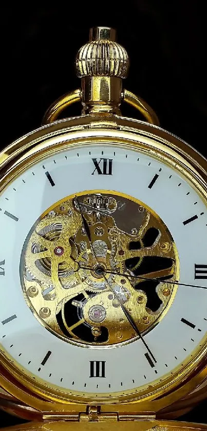 Gold pocket watch on a black background.