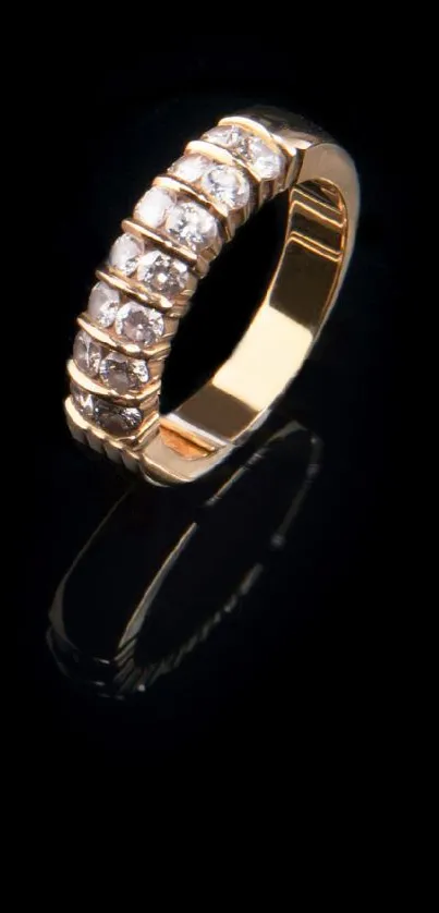 Elegant gold ring with diamonds on a black background.