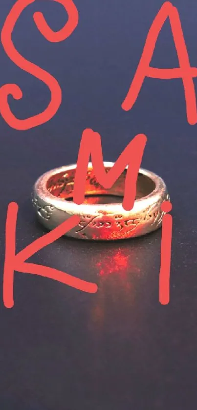 Gold ring on dark background with red letters.