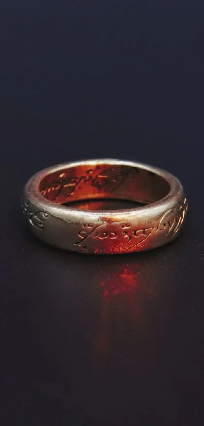 Glowing gold ring on a dark background with intricate engravings.