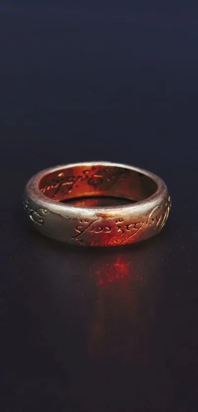 Elegant gold ring on a dark blue background with intricate details.