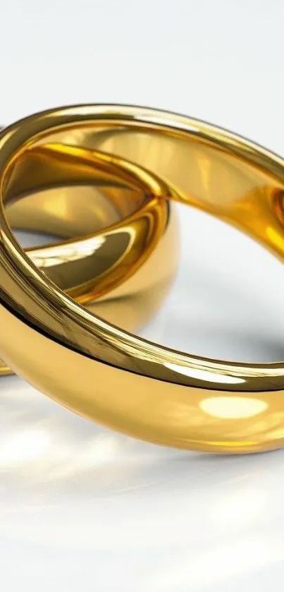 Elegant gold rings with reflective shine, ideal for a luxury wallpaper.