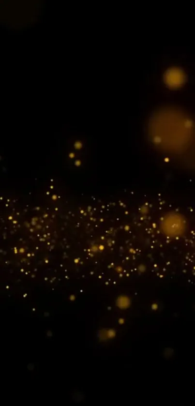 Gold sparkles on a dark background, creating an elegant mobile wallpaper.