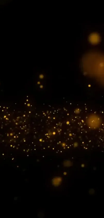 Gold sparkles on dark background mobile wallpaper.