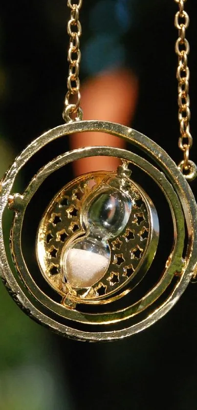 Elegant gold time-turner with intricate design.