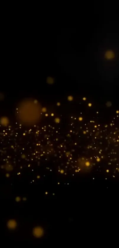 Elegant black wallpaper with golden sparkles glowing softly.