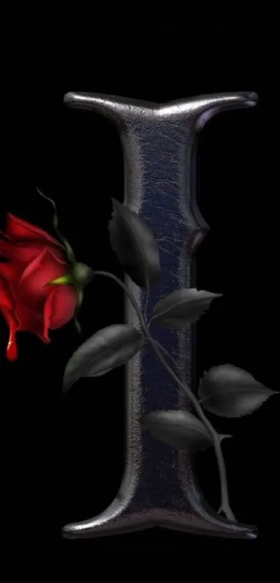 Gothic metallic letter with red rose on black background.