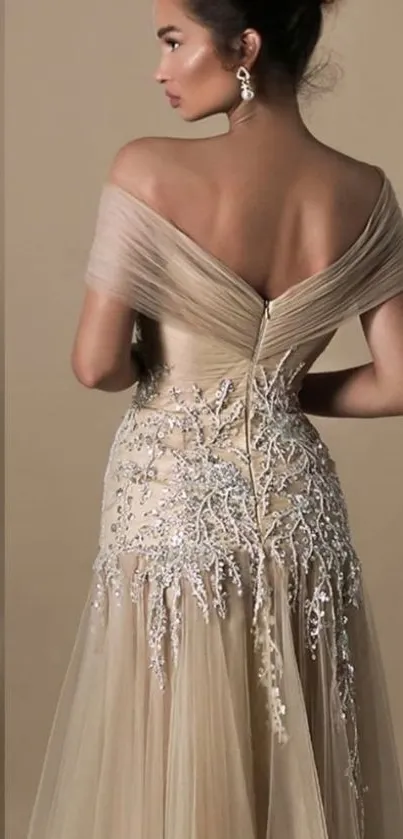 Elegant beige gown with silver details.