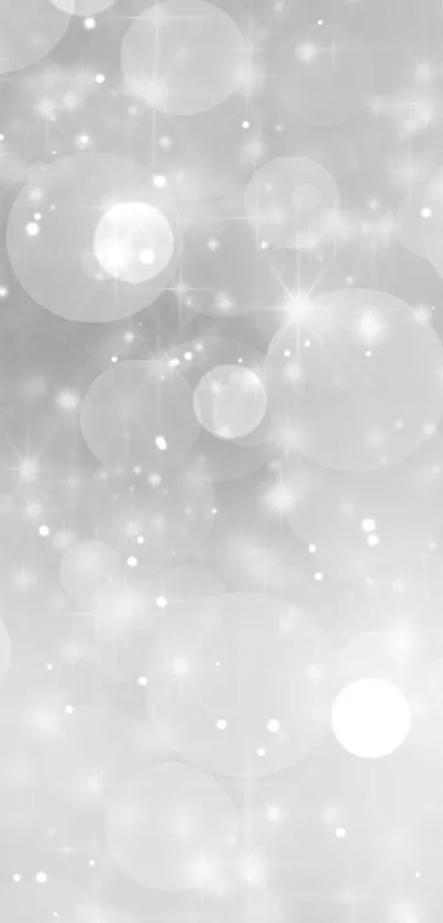 Elegant gray bokeh wallpaper with soft circles creating a serene background.