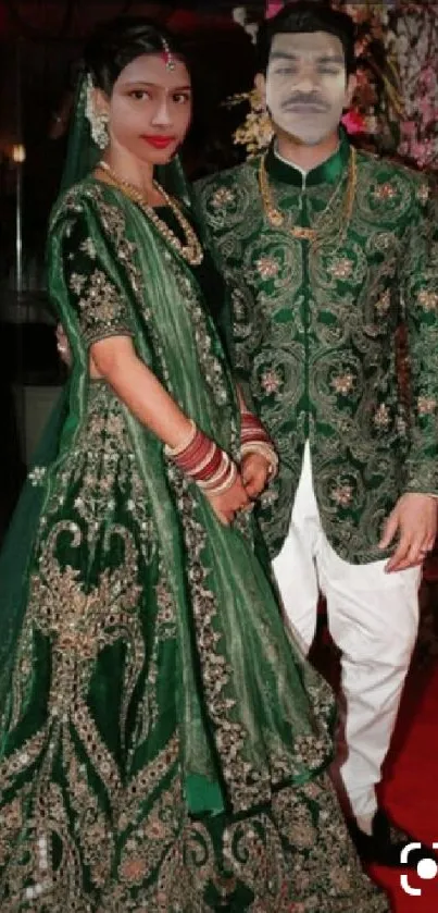 Elegant couple in matching green attire on a vibrant background.