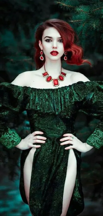 Elegant woman in a dark green dress with red accents standing in a forest.