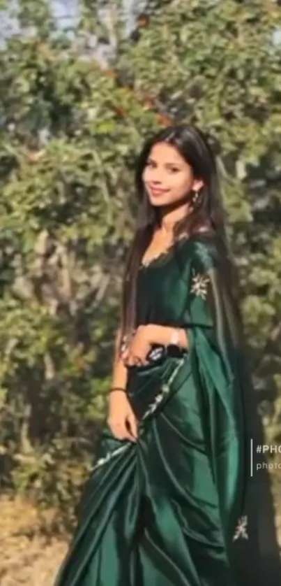 Outdoor portrait of a woman in a green saree.