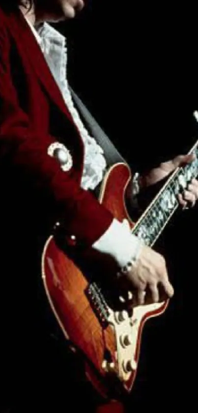 Guitarist passionately playing on a dimly lit stage.