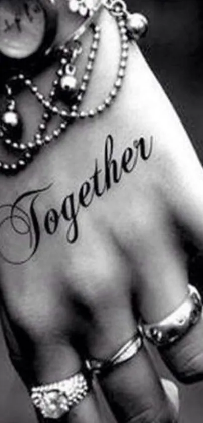 Black and white hand with jewelry and 'Together' text.