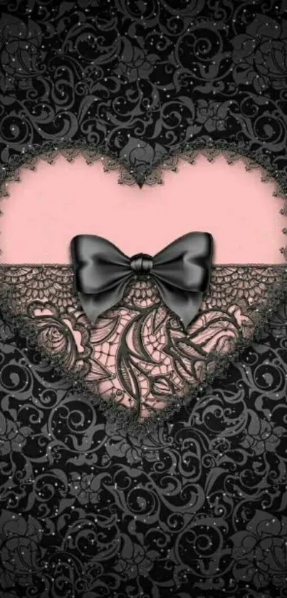 Elegant black lace heart with a pink background and black bow wallpaper.