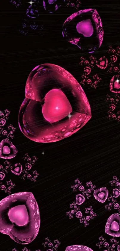 Fractal hearts in pink and purple on a black background.