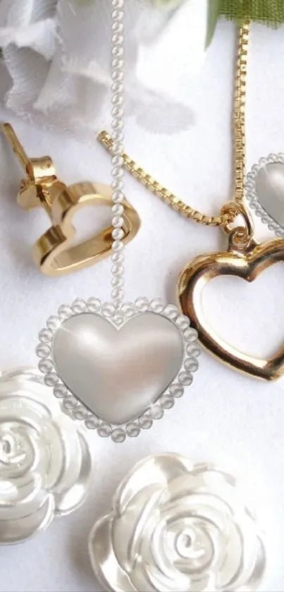 Gold and silver heart jewelry with white rose accents.