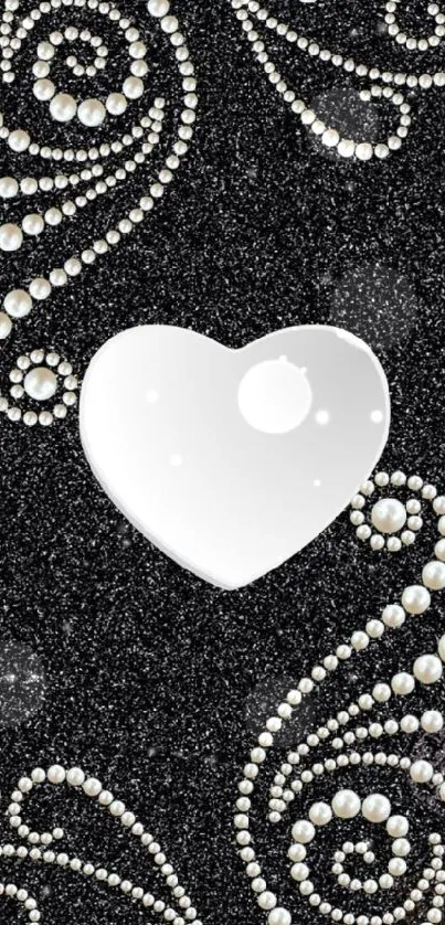 Black wallpaper with a pearl heart design.