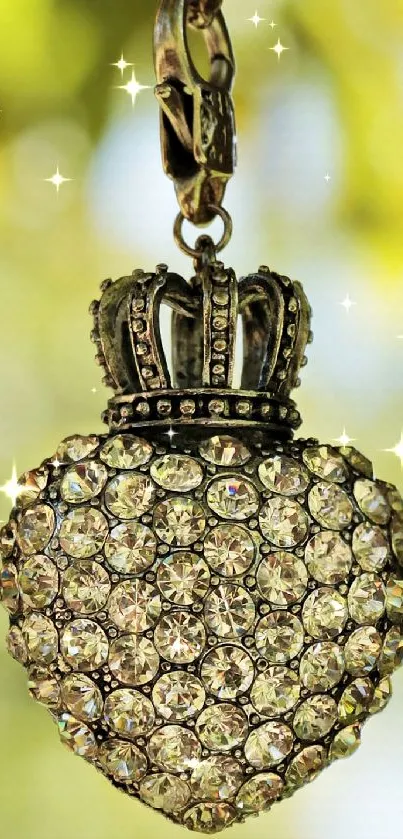 Heart-shaped jeweled pendant hanging from a tree branch.