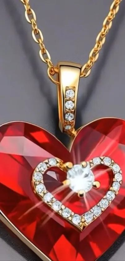 Red heart pendant with golden chain on dark background.