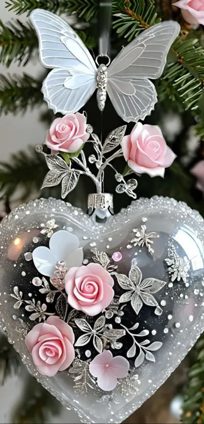 Elegant heart-shaped ornament with pink roses and butterfly on tree.