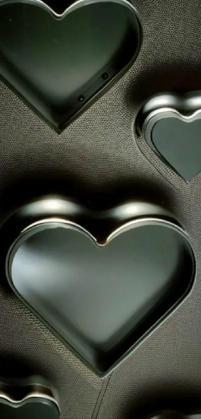 Mobile wallpaper with metallic heart shapes on a dark textured background.