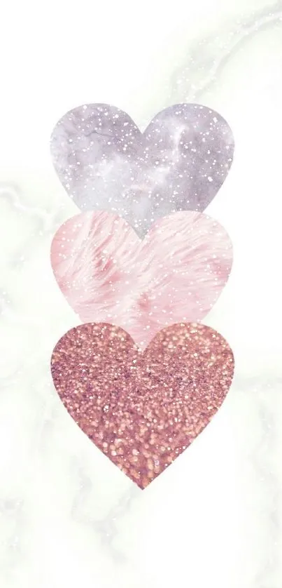 Three textured hearts in a vertical row on a white background.