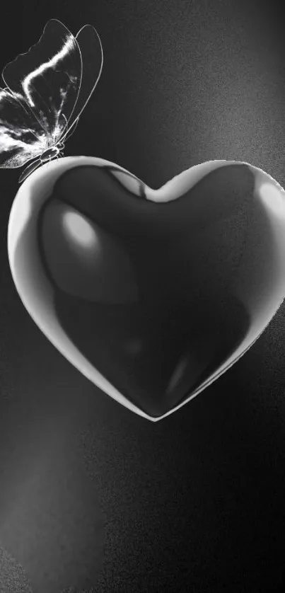 Glossy black heart with butterfly in elegant mobile wallpaper.